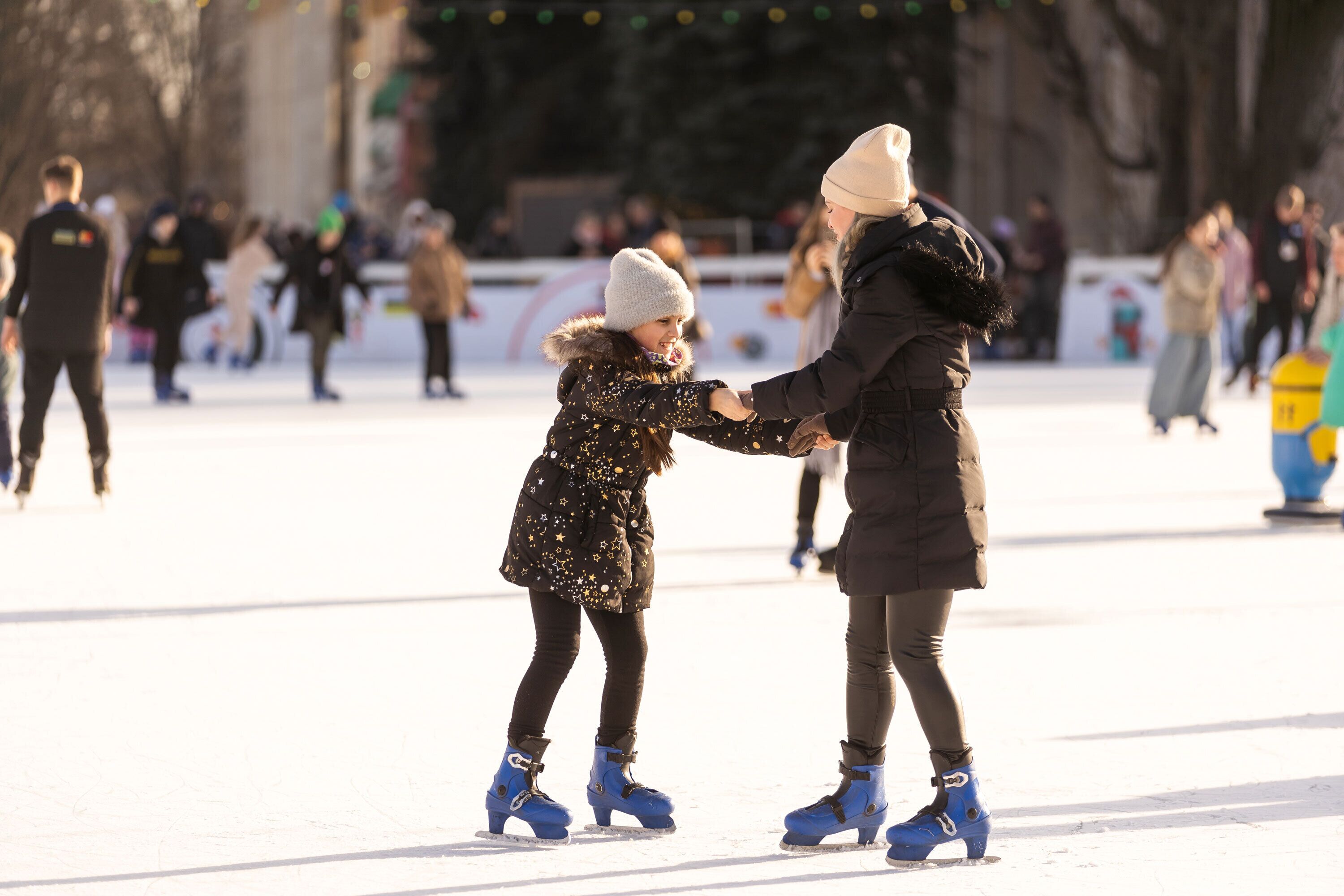A group of people on an ice rink.