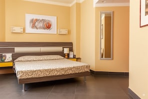 Family Room | Minibar, in-room safe, desk, iron/ironing board