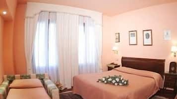 Triple Room | Minibar, in-room safe, desk, soundproofing