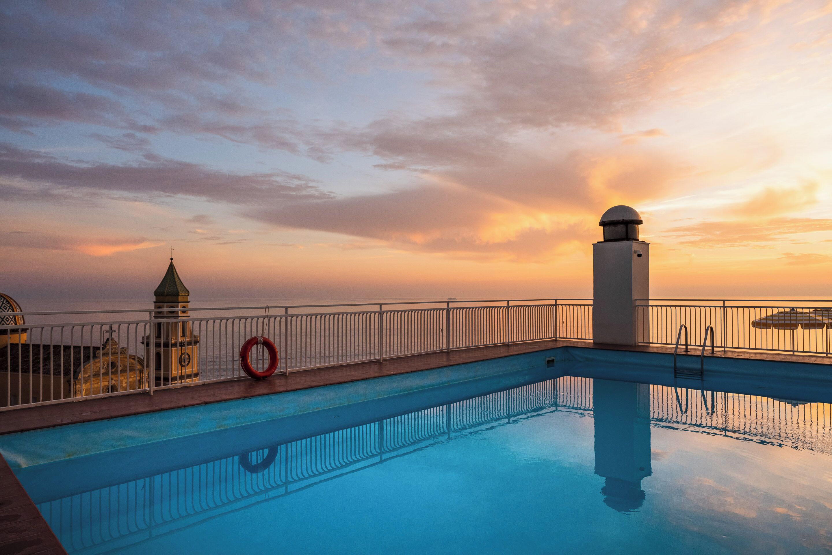 seasonal outdoor pool, open 9:00 am to 8:00 pm, pool umbrellas