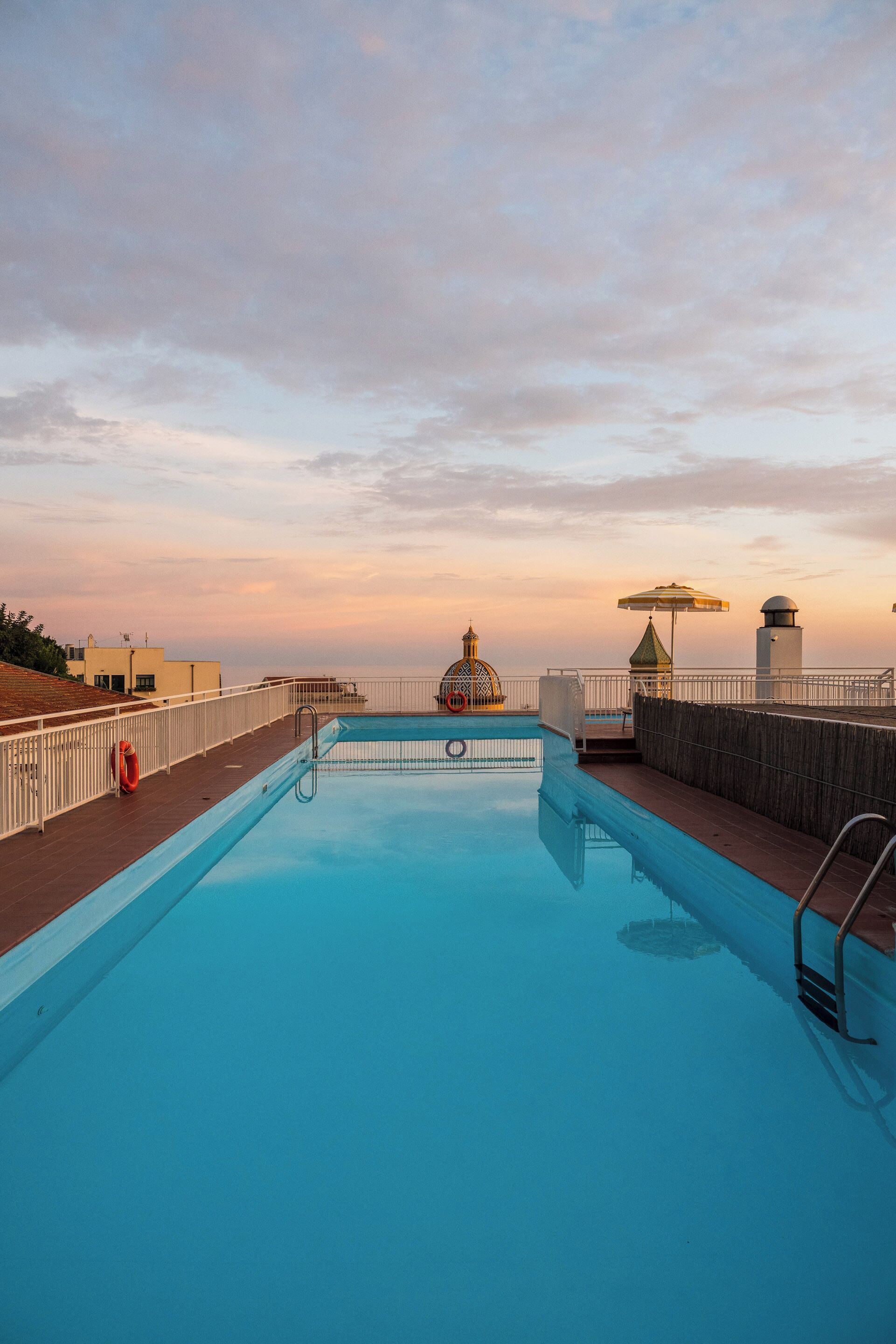 seasonal outdoor pool, open 9:00 am to 8:00 pm, pool umbrellas