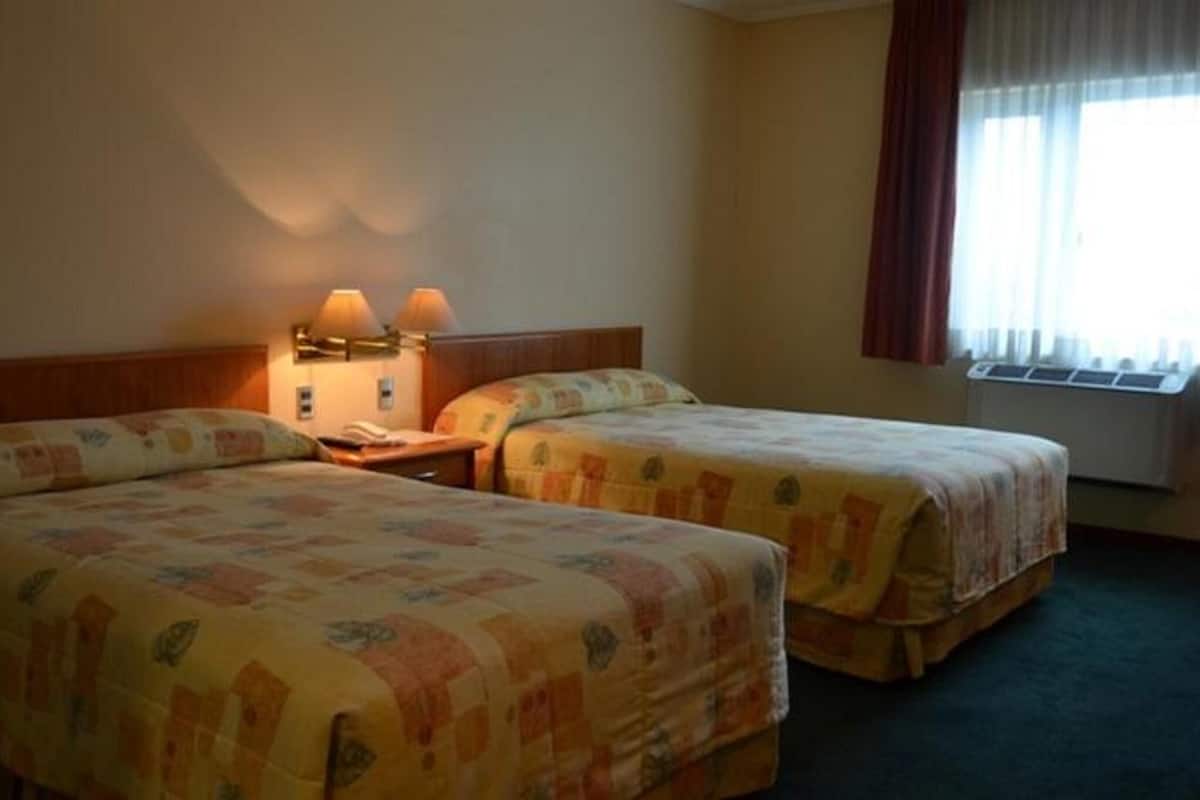 Luxe beddengoed, een minibar, een kluis op de kamer, een bureau
