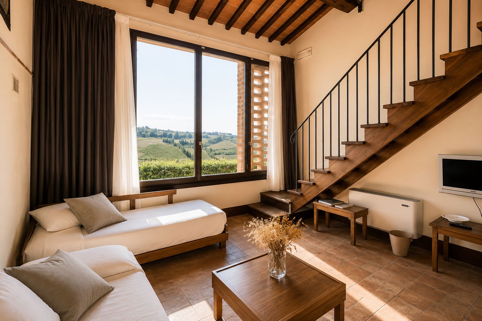 Una sala de estar moderna con un sofá, una mesa de centro, un televisor y una escalera.