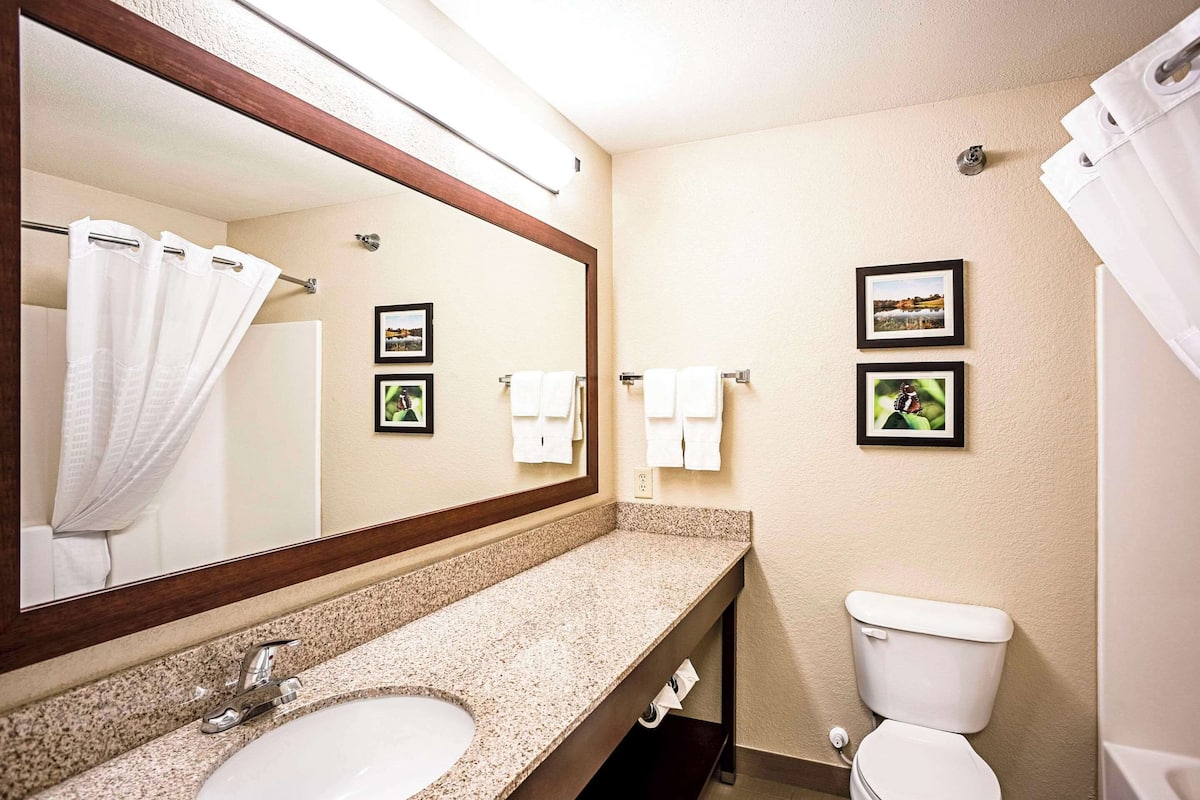 premium bedding, desk, laptop workspace, blackout curtains