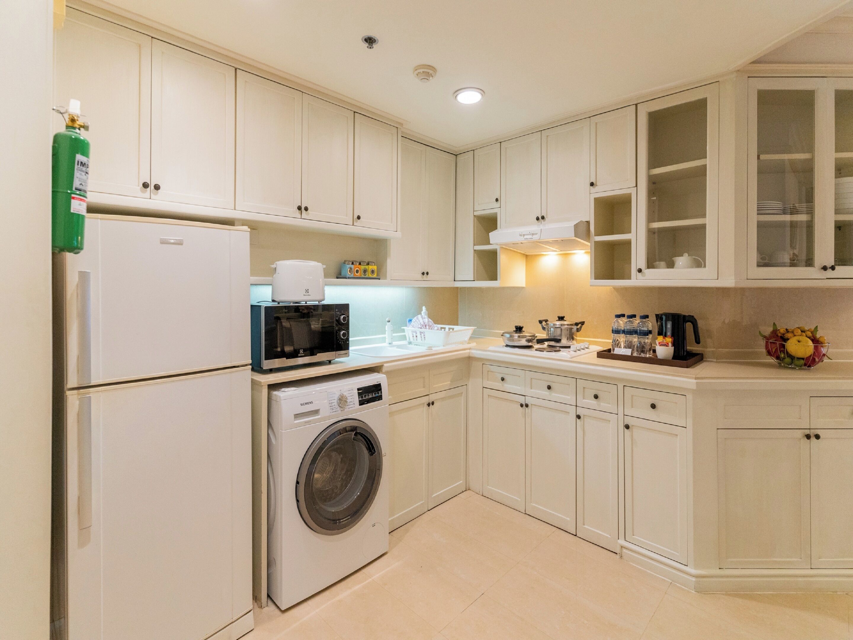 three-bedroom family grand suite | private kitchen | full-sized fridge, microwave, electric kettle