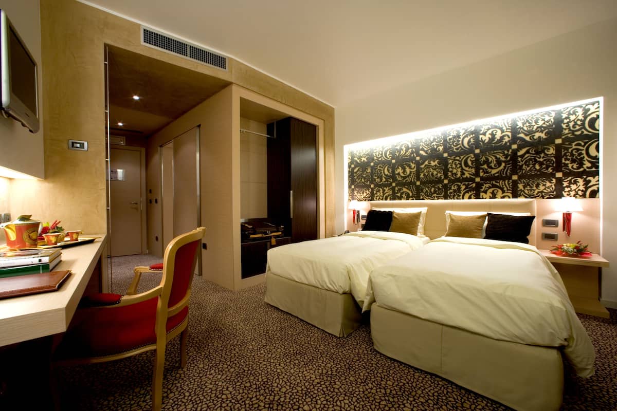 Premium bedding, down duvets, minibar, in-room safe