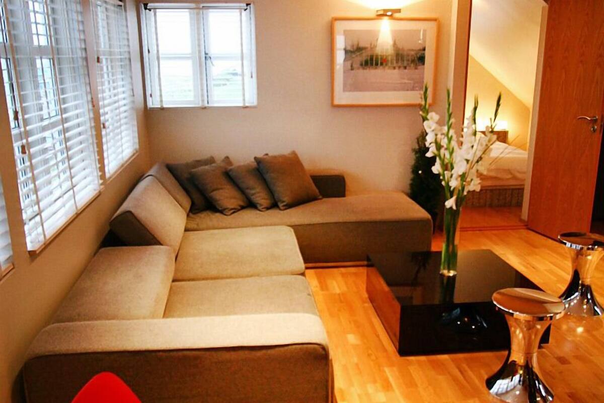 Deluxe Penthouse, 2 Bedrooms | Living room | Flat-screen TV, video-game console, DVD player