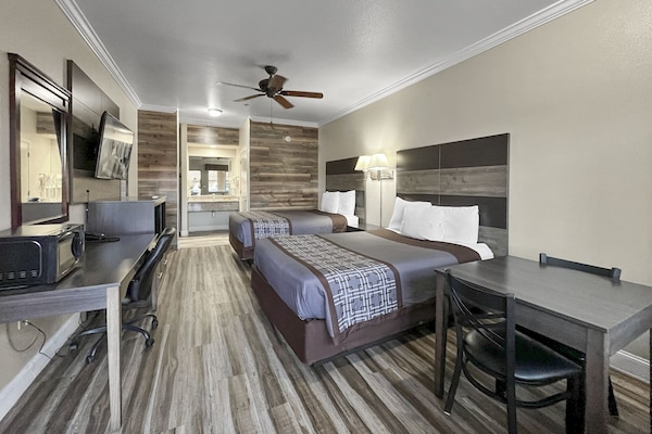 Deluxe Room, 2 Queen Beds | Desk, laptop workspace, blackout curtains, iron/ironing board