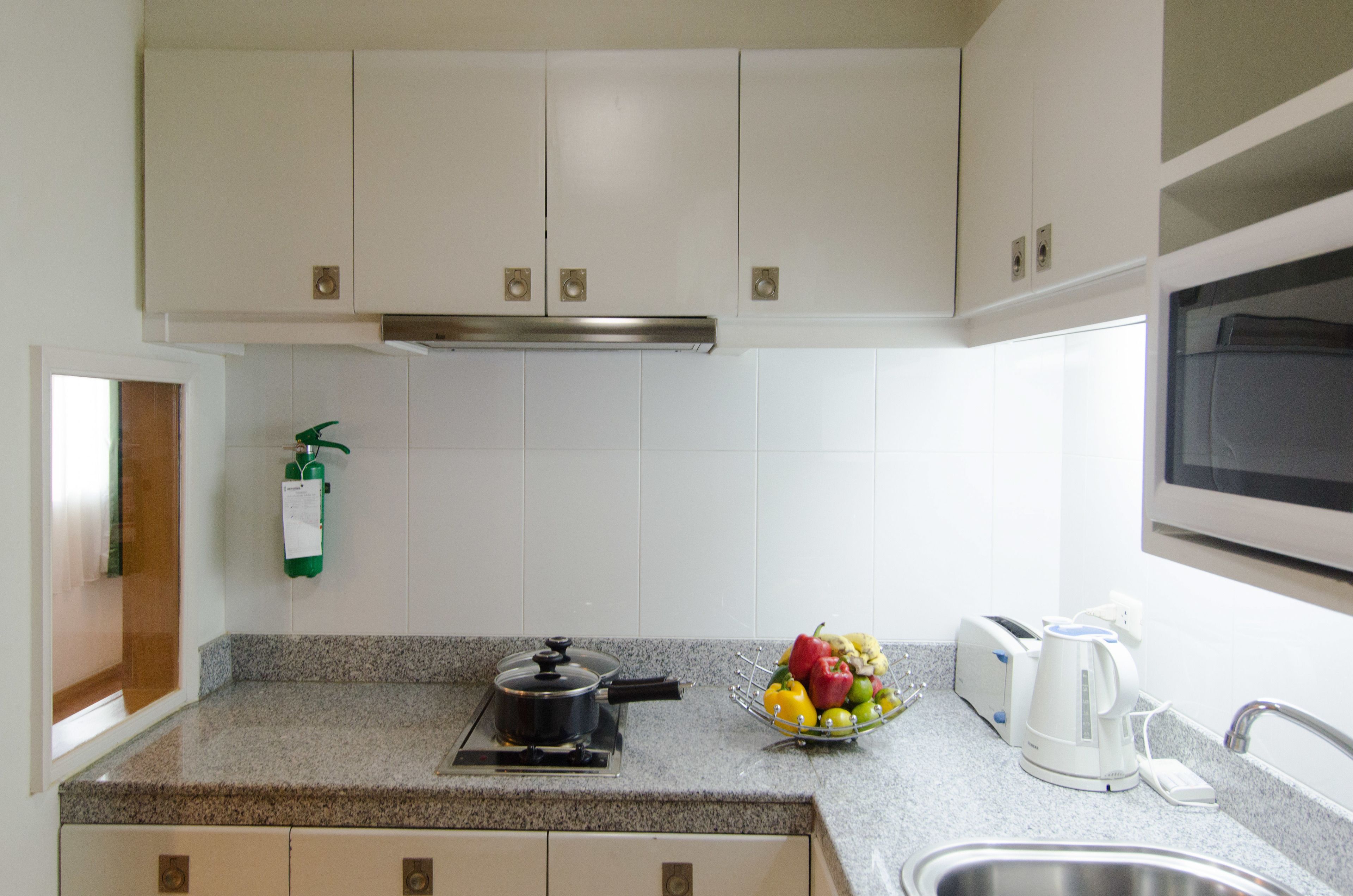 fridge, microwave, electric kettle, cookware/dishes/utensils