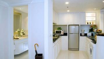 Premier Suite, 2 Bedrooms | Private kitchen | Fridge, microwave, dining tables