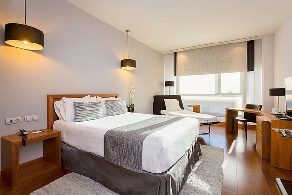 Premium bedding, memory-foam beds, minibar, in-room safe