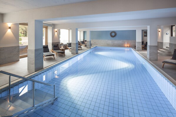 Indoor pool, open 7:00 AM to 8:00 PM, pool loungers