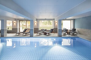 Indoor pool, open 7:00 AM to 8:00 PM, pool loungers