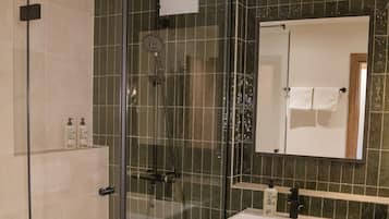 Shower, free toiletries, hair dryer, towels