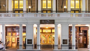 A Renaissance hotel with a grand entrance, large columns, and a well-lit facade. - The Battle House Renaissance Mobile Hotel & Spa (Mobile)