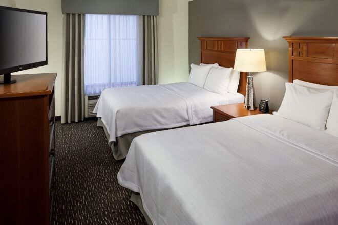 Premium bedding, desk, laptop workspace, blackout curtains