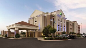 A hotel with a covered entrance, multiple floors, and a parking lot. - Holiday Inn Express & Suites Shawnee by IHG (Shawnee)