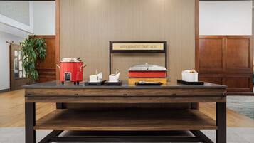 A breakfast bar with a sign that reads "HAPPY BREAKFAST STARTS HERE".