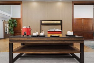 A breakfast bar with a sign that reads "HAPPY BREAKFAST STARTS HERE".