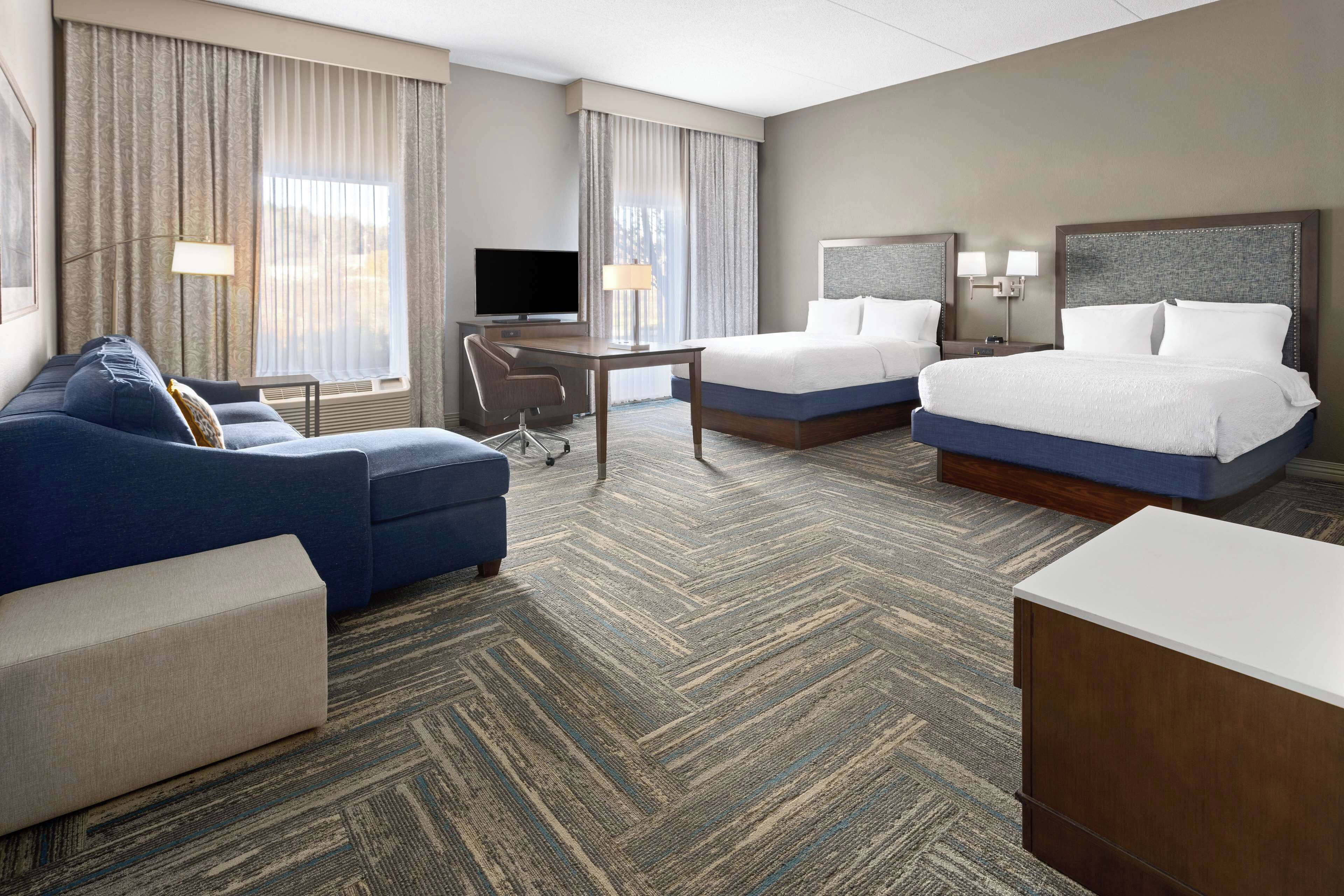 studio suite two queens sofabed | living area | 48-inch tv with satellite channels, pay films, mp3 dock