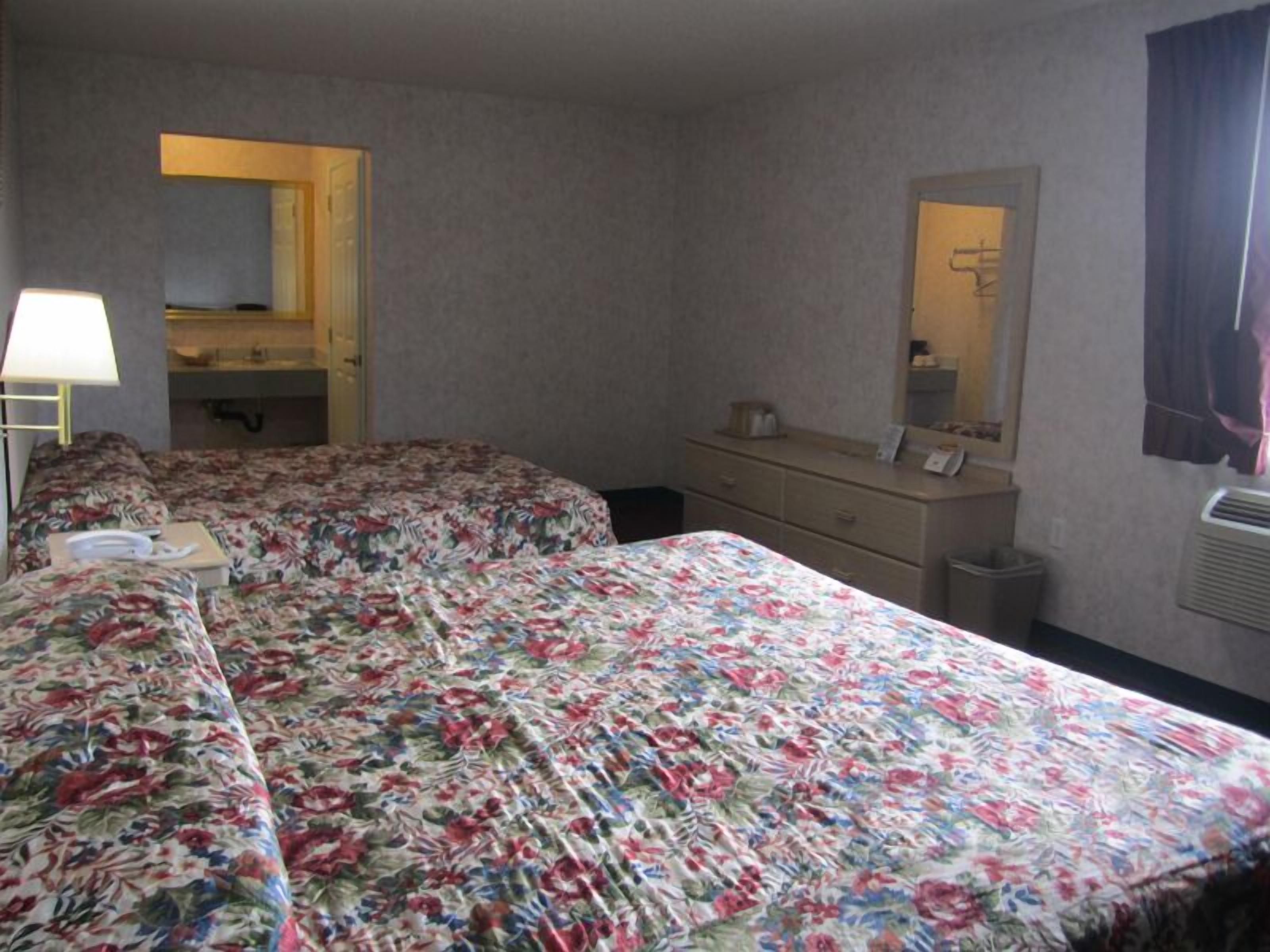 Economy Room, 2 Queen Beds | Pillowtop beds, free WiFi, bed sheets