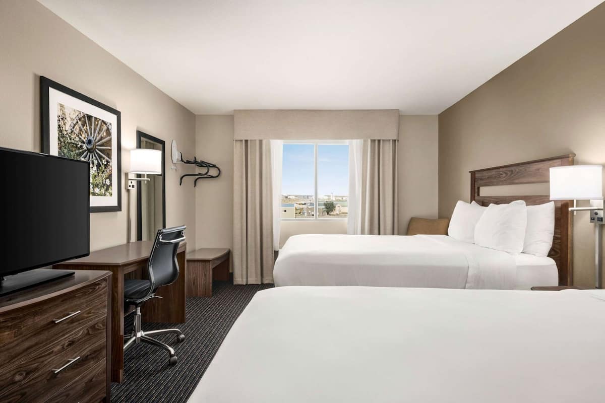 Desk, blackout drapes, iron/ironing board, free cribs/infant beds