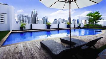 Outdoor pool, open 6 AM to 10 PM, pool loungers