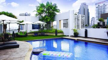 Outdoor pool, open 6 AM to 10 PM, pool loungers