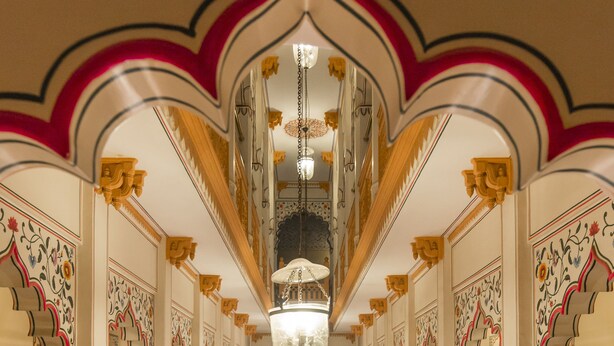 A luxurious hotel lobby with ornate decor, a central chandelier, and seating areas. - Umaid Mahal - A Heritage Style Boutique Hotel (Jaipur)