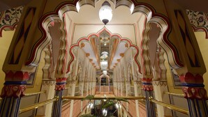 A grand hallway with ornate arches and a central chandelier. - Umaid Mahal - A Heritage Style Boutique Hotel (Jaipur)