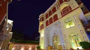 A historic building with ornate architecture, including detailed carvings and a large central archway. - Umaid Mahal - A Heritage Style Boutique Hotel (Jaipur)