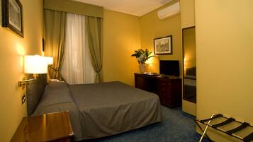 Standard Double Room | Minibar, in-room safe, desk, blackout drapes