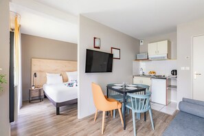 Studio | Desk, blackout drapes, soundproofing, iron/ironing board