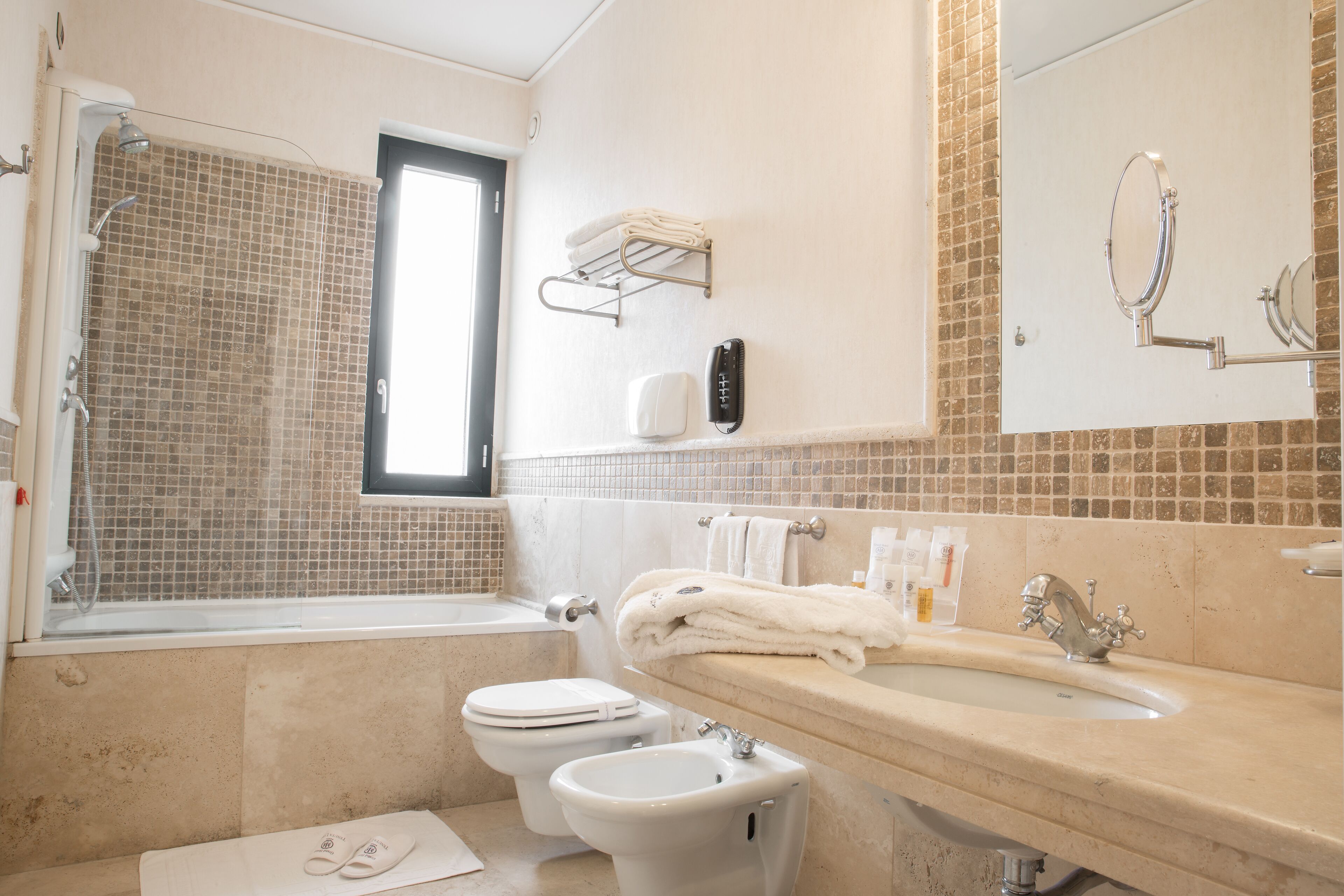 hair dryer, bidet, towels, soap