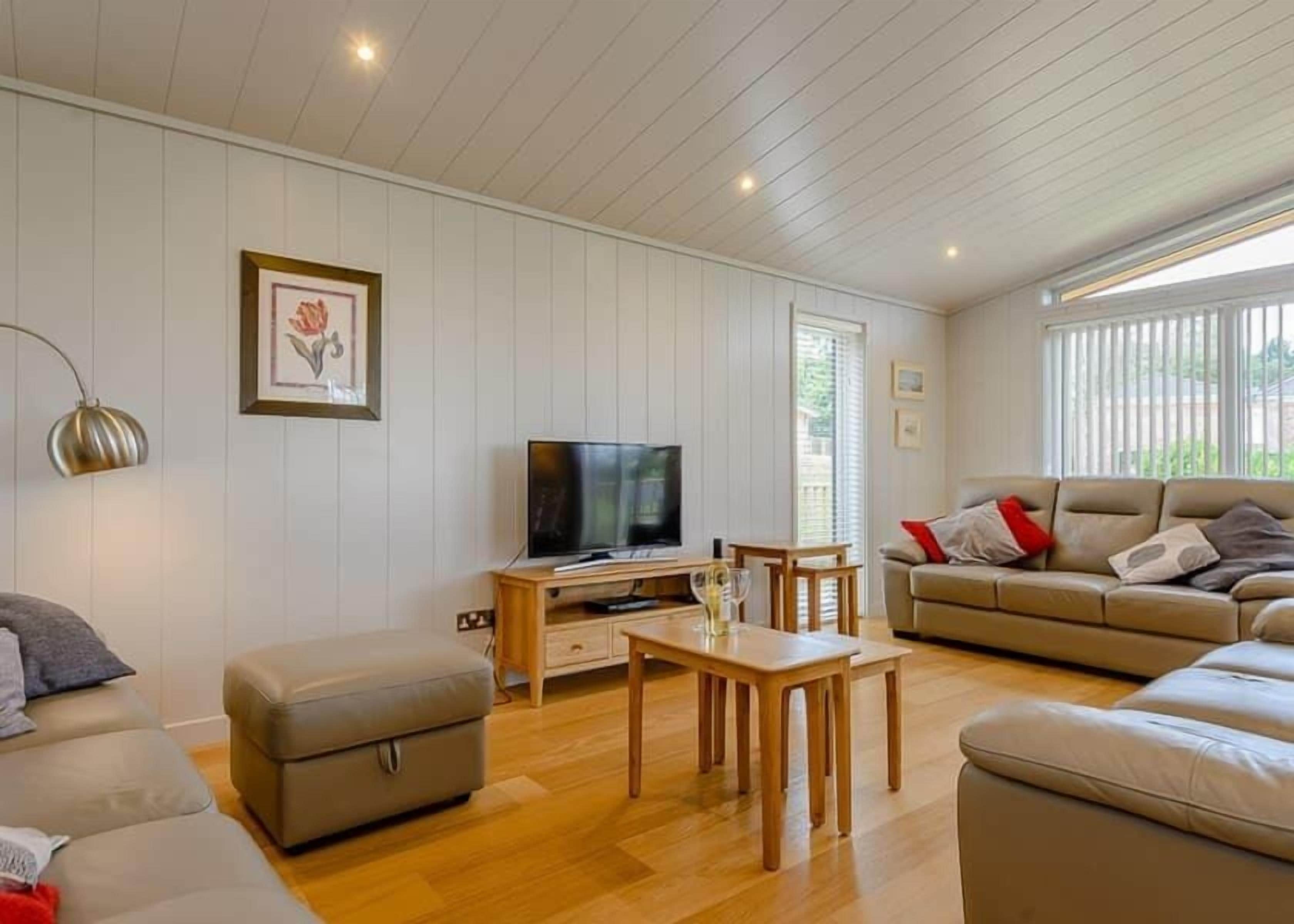 standard room, multiple beds, kitchen | living area | flat-screen tv