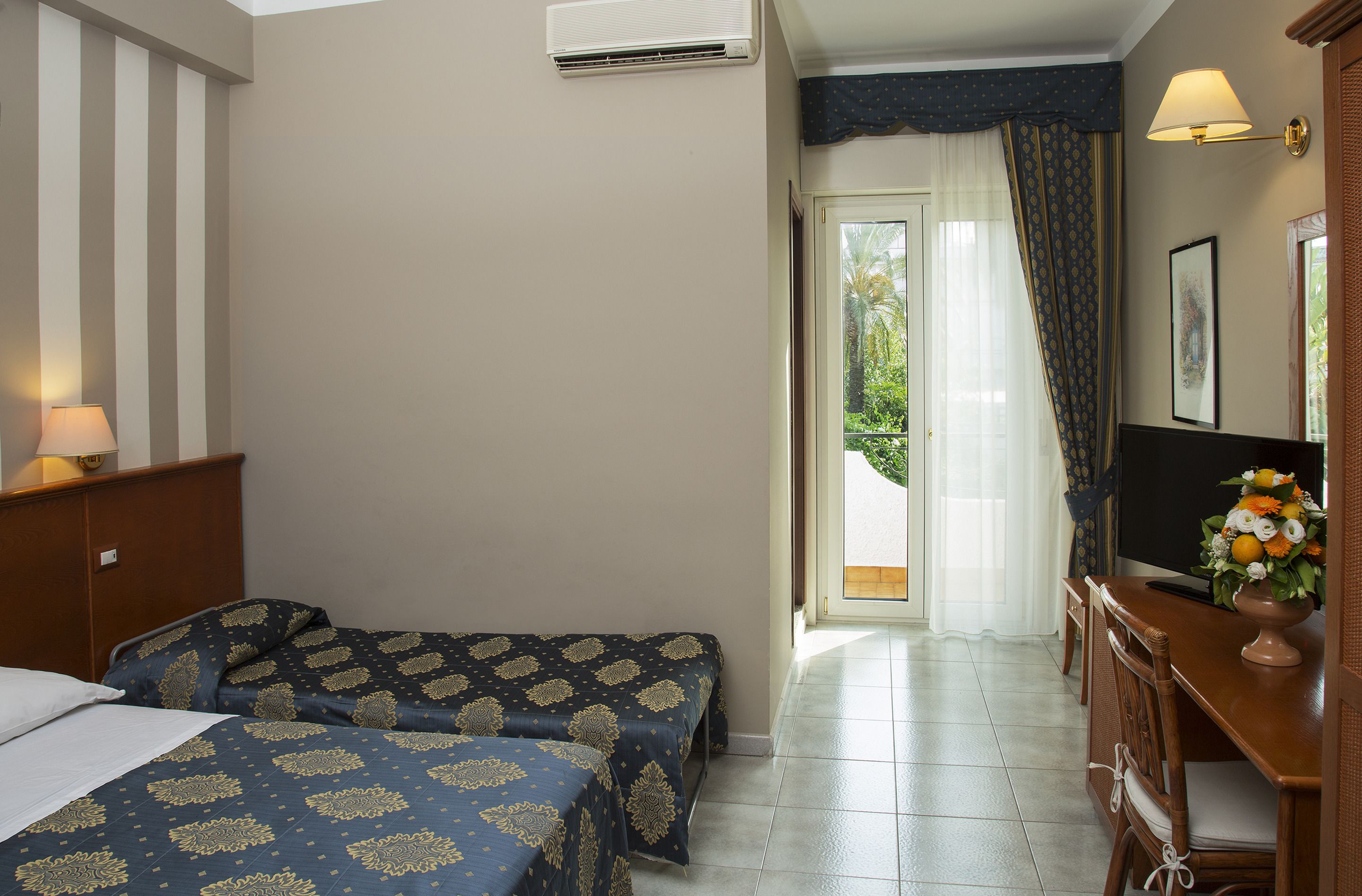 economy triple room | minibar, in-room safe, desk, free wifi