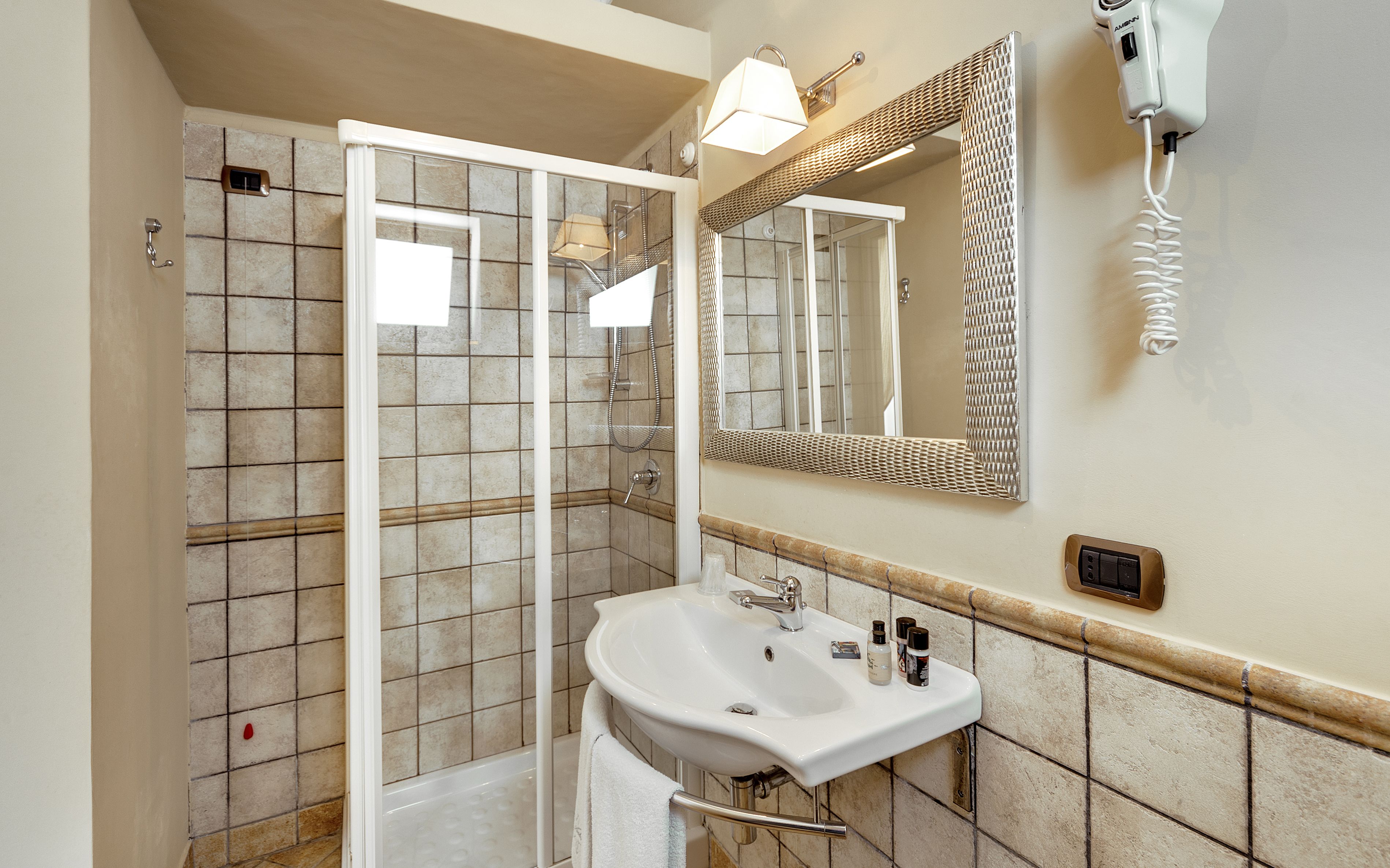 combined shower/bathtub, designer toiletries, hair dryer, bidet