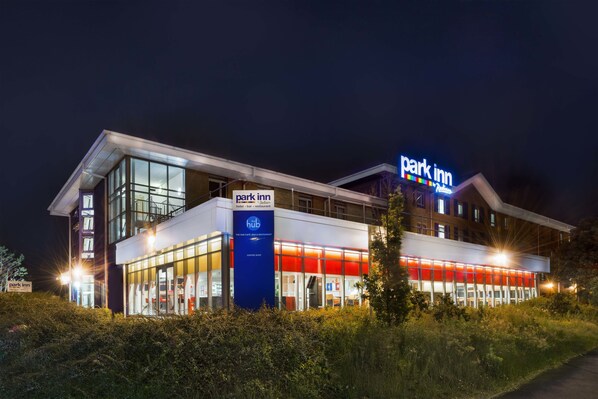 A modern hotel with a 'Park Inn' sign, a 'The Hub' sign, and a 'Park Inn' restaurant sign. - Park Inn by Radisson Birmingham Walsall M6 J9 (Walsall)