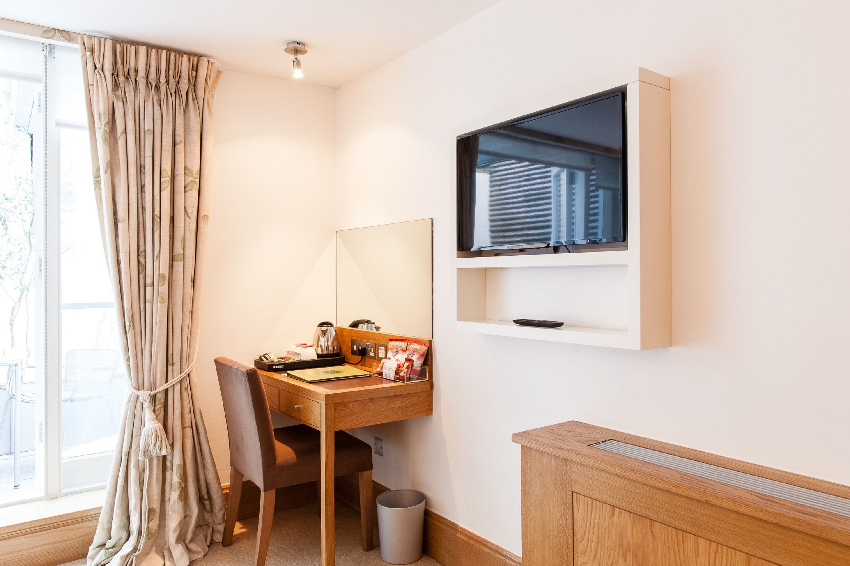 garden room | minibar, in-room safe, desk, blackout curtains