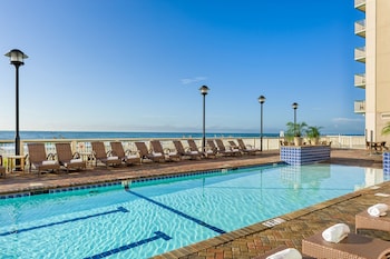 Outdoor pool, sun loungers at Westgate Myrtle Beach Oceanfront Resort