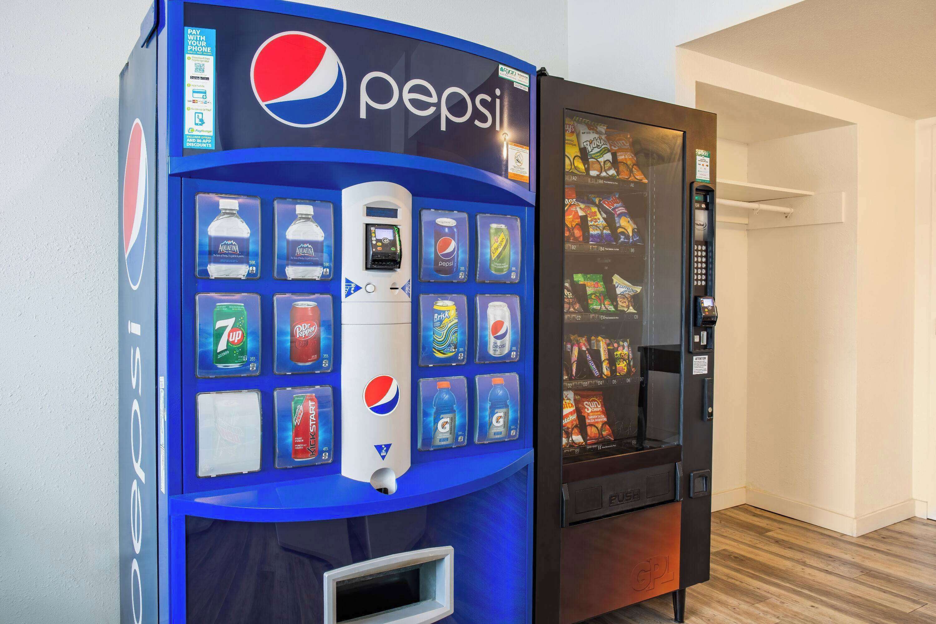 A vending machine with a Pepsi logo and various drink options.