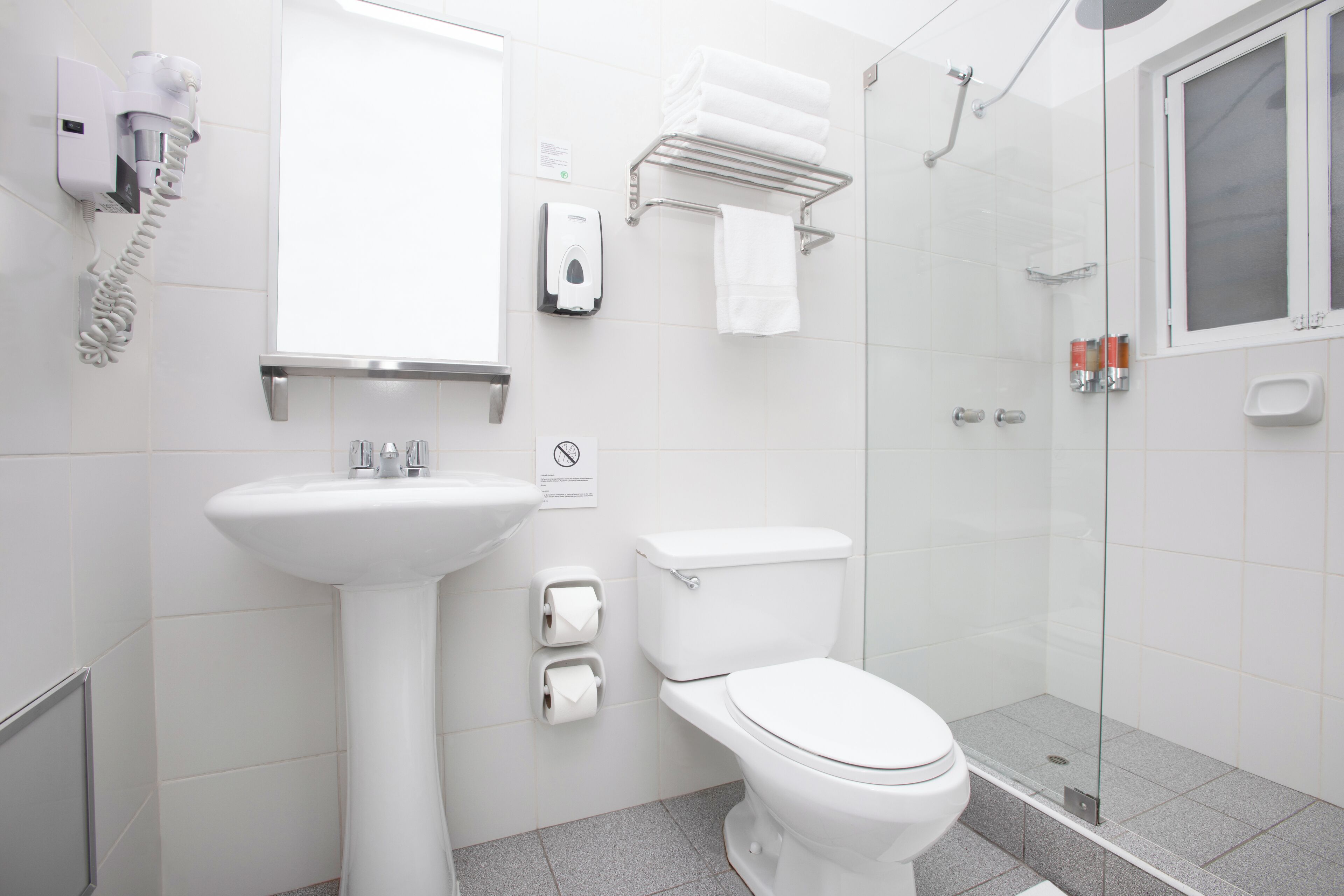 shower, designer toiletries, hair dryer, towels