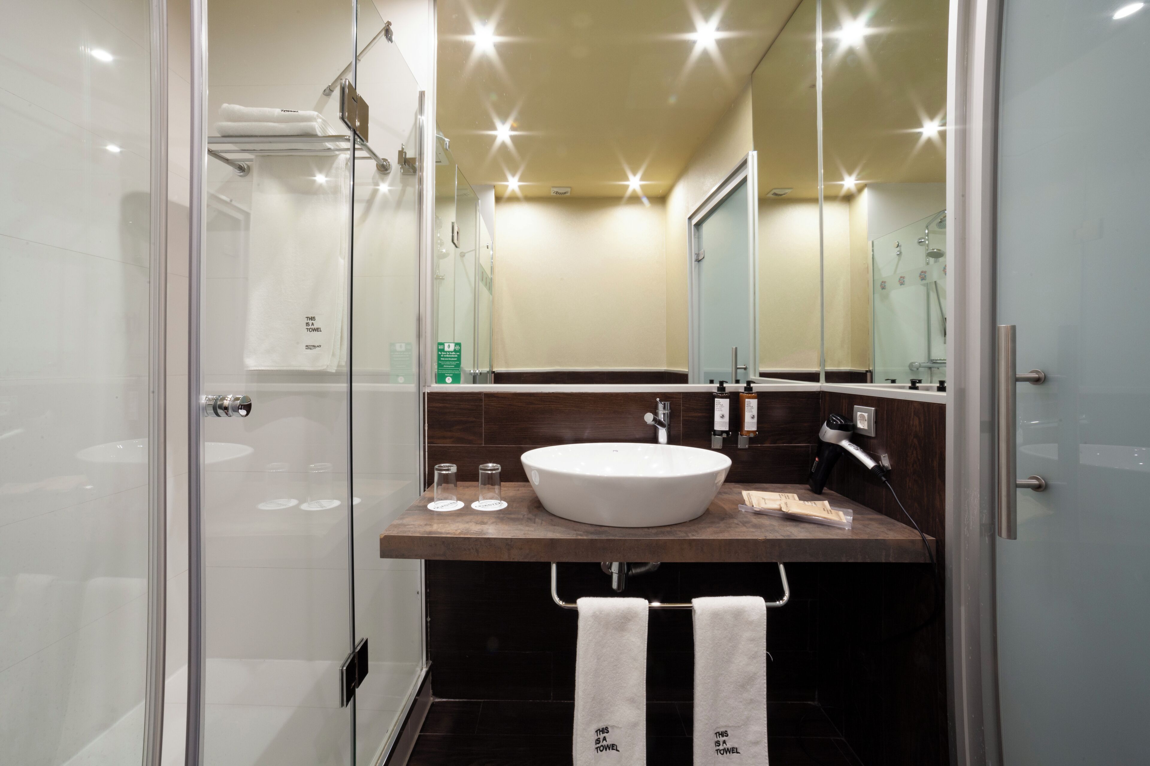 deep-soaking bathtub, hair dryer, towels, soap