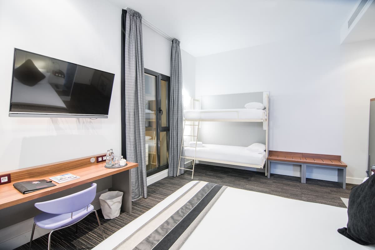 superior quadruple room | minibar, in-room safe, desk, blackout curtains