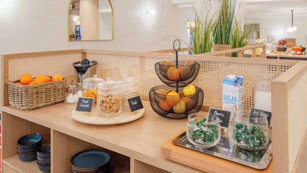A breakfast buffet with various food items and containers.