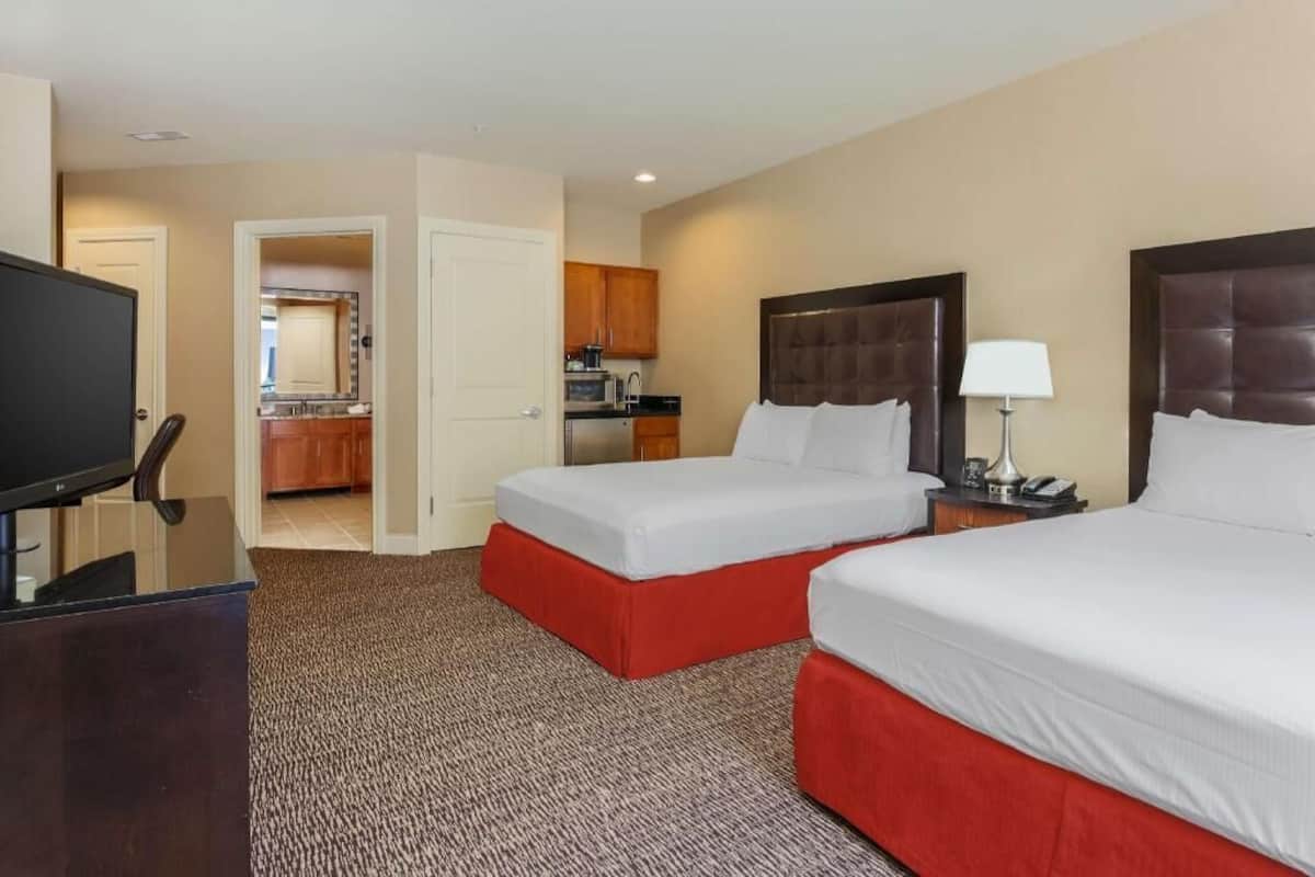 Premium bedding, pillow-top beds, in-room safe, blackout curtains