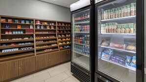 A grocery store with shelves stocked with various food items and a freezer section. - Holiday Inn Express Hotel & Suites Rolla - U of Missouri S&T by IHG (Rolla)