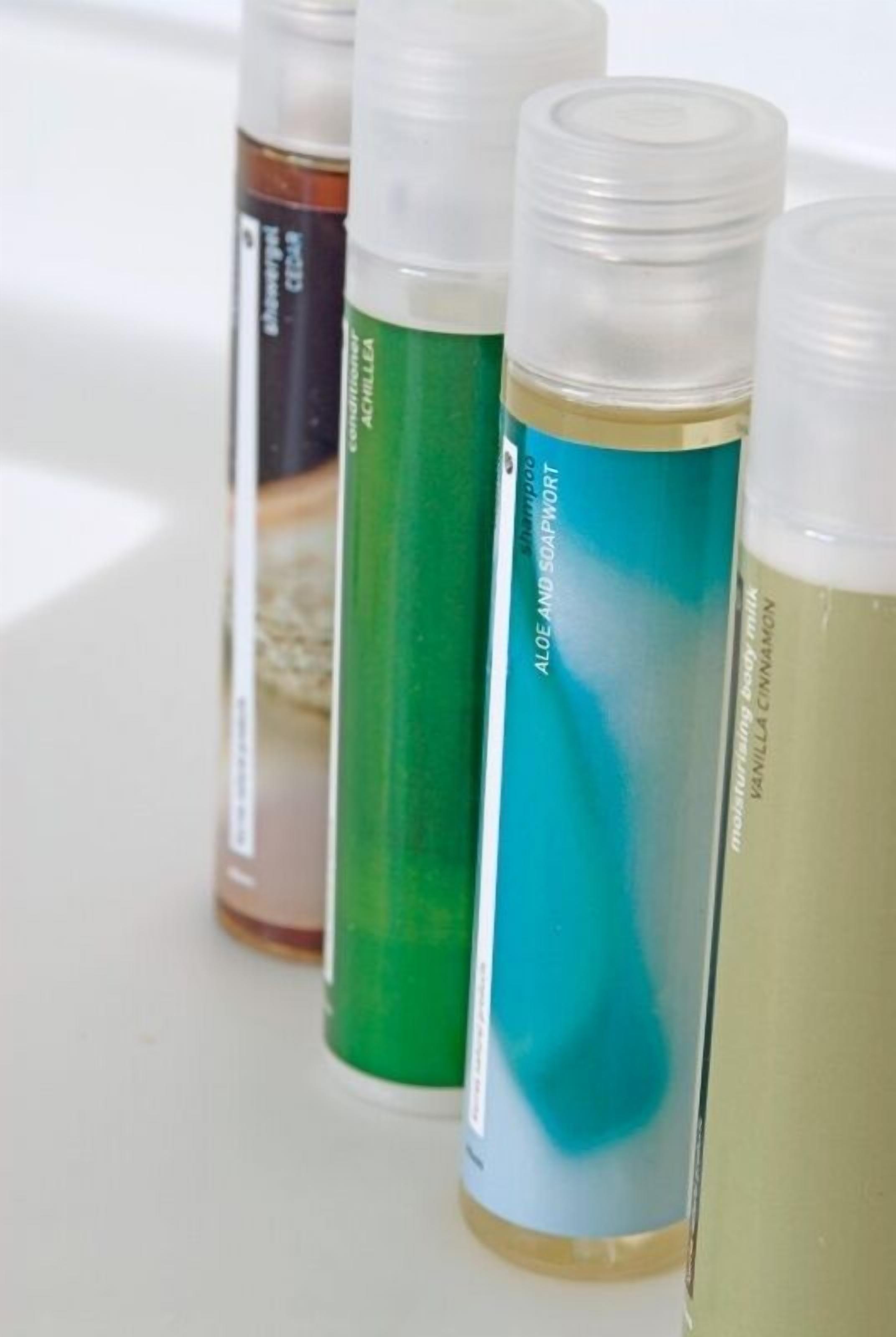 Four bottles of liquid soap with different scents.