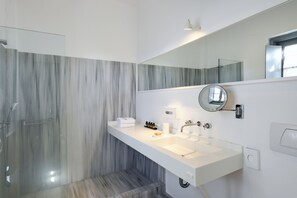 Superior Room | Bathroom | Designer toiletries, hair dryer, slippers, towels