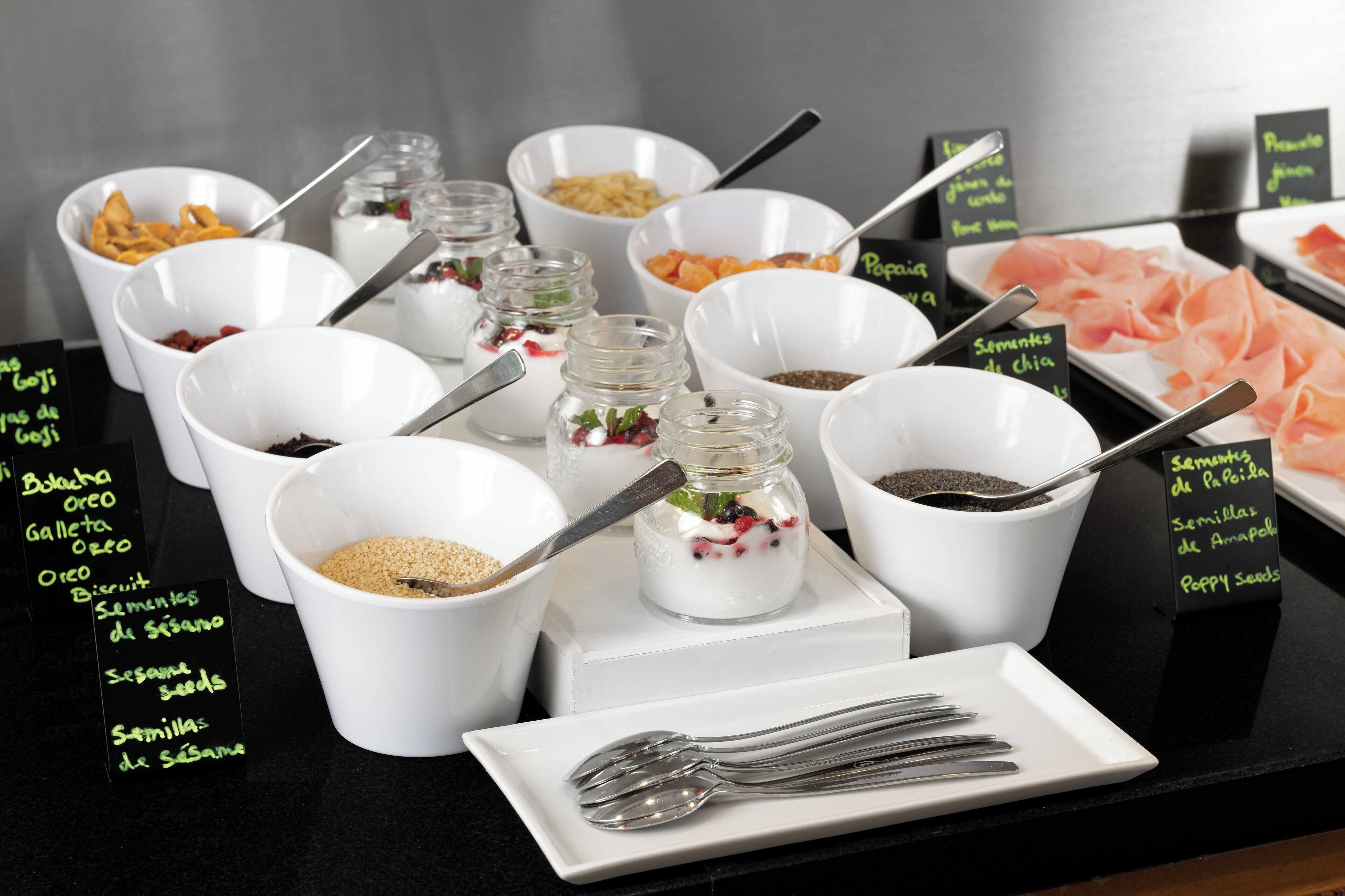 A buffet with various food items and condiments.